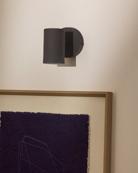 Applique murale Manie en métal avec finition effet fonte noire