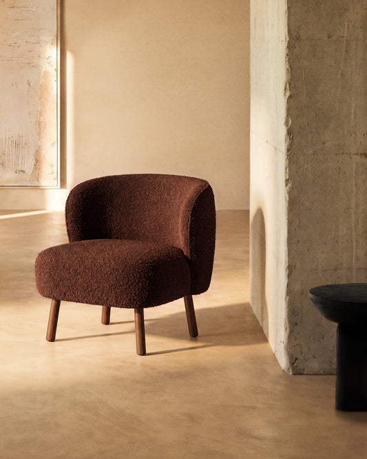 Ulit armchair in terracotta bouclé with solid ash wood legs in a walnut finish