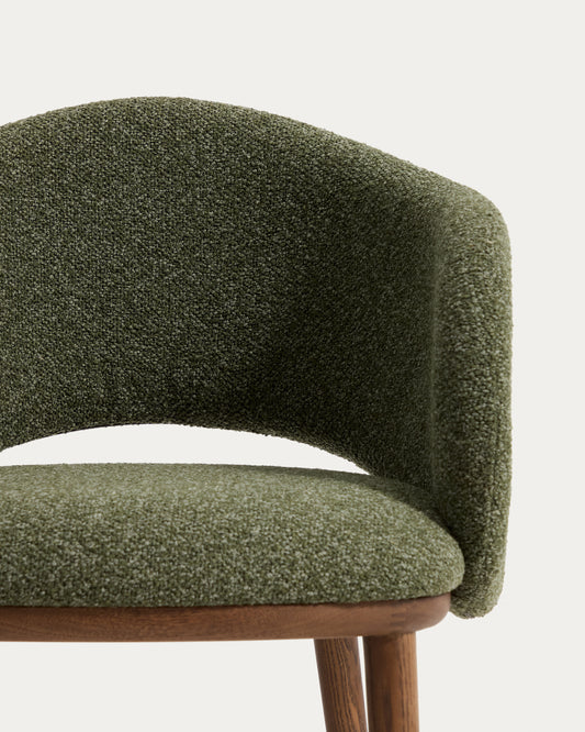Maina chair in thick green chenille with solid ash wood legs and a walnut-tone finish, FSC Mix Credit