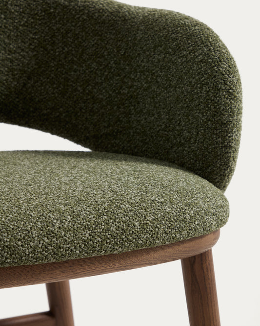 Maina stool in thick green chenille with solid ash wood legs and a walnut-tone finish, FSC Mix Credit 65 cm