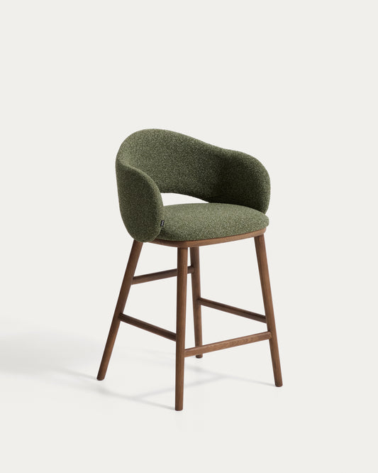 Maina stool in thick green chenille with solid ash wood legs and a walnut-tone finish, FSC Mix Credit 65 cm