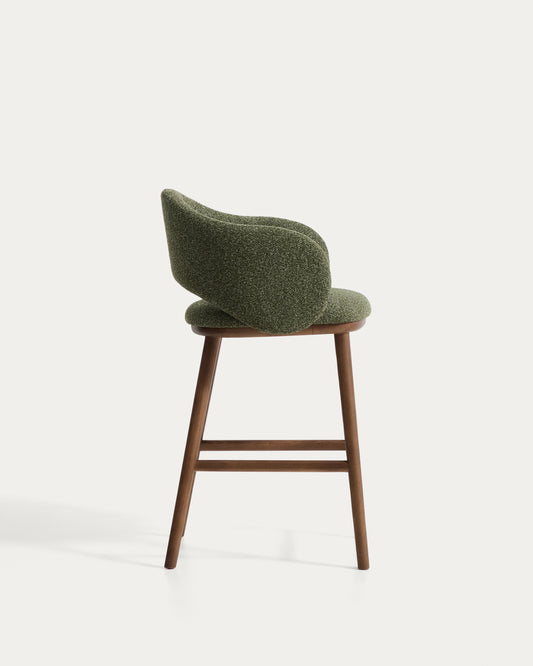 Maina stool in thick green chenille with solid ash wood legs and a walnut-tone finish, FSC Mix Credit 65 cm