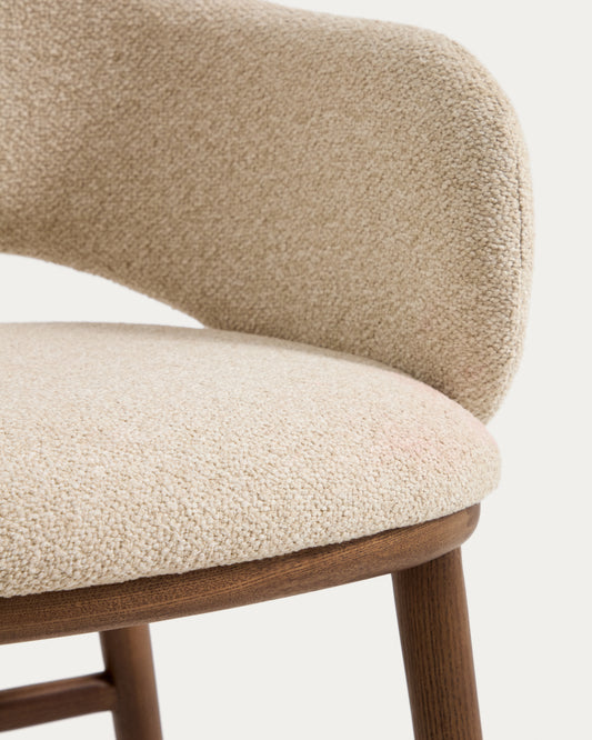 Maina stool in thick beige chenille with solid ash wood legs and a walnut-tone finish, FSC Mix Credit 65 cm